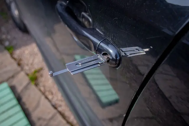 A locksmith tool set into a car door lock