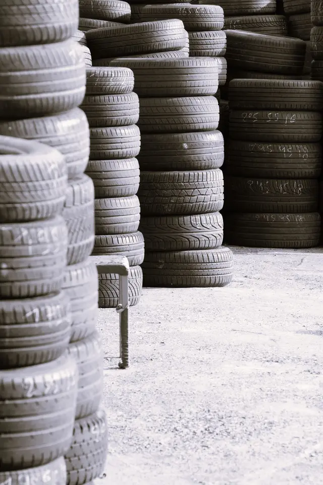 Stacks of used tires in a warehouse